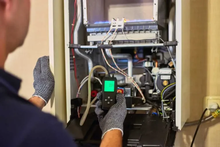 Technician working on a residential heating system