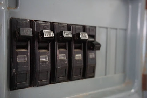 Electrical panel with one breaker tripped.